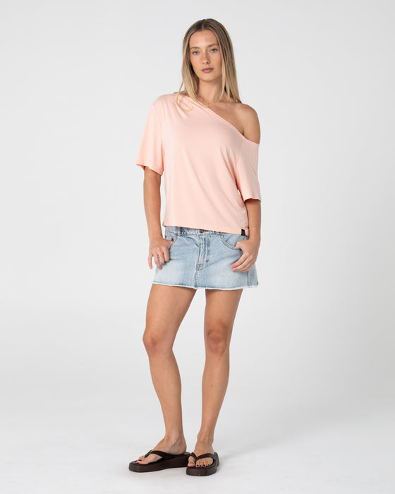 woman-wearing-sally-slouch-off-shoulder-tee-in-peach-pink
