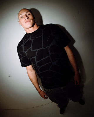 Man wearing Taipan Short Sleeve Tee in Black