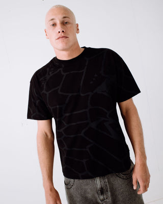 Man wearing Taipan Short Sleeve Tee in Black