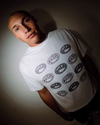 Man wearing Heat Check Short Sleeve Tee in White