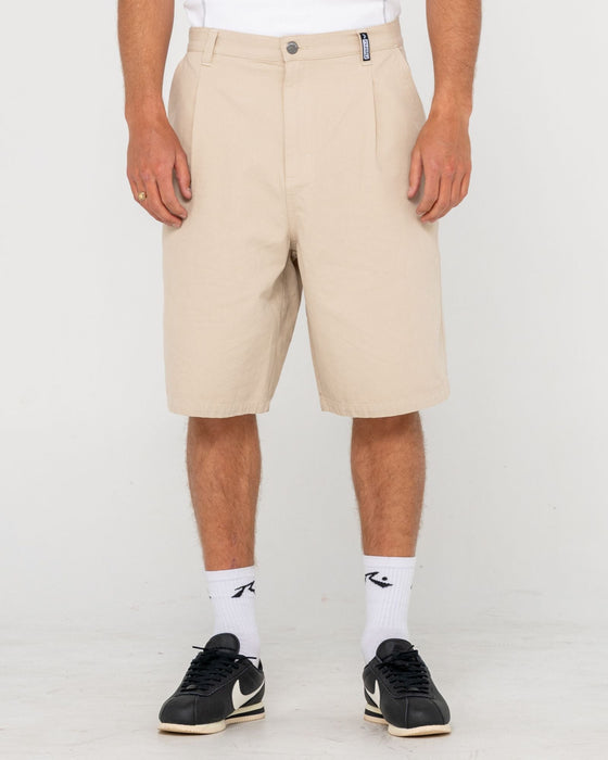 man-wearing-shindawg-pleated-short-in-abbey-stone