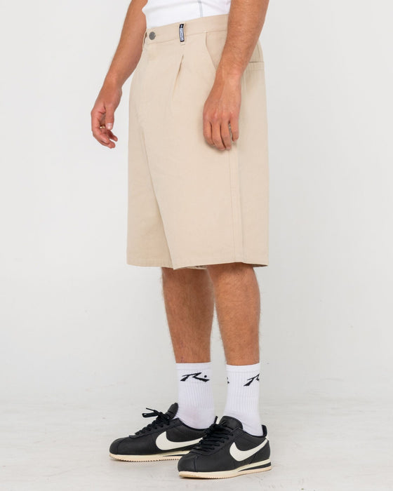 man-wearing-shindawg-pleated-short-in-abbey-stone