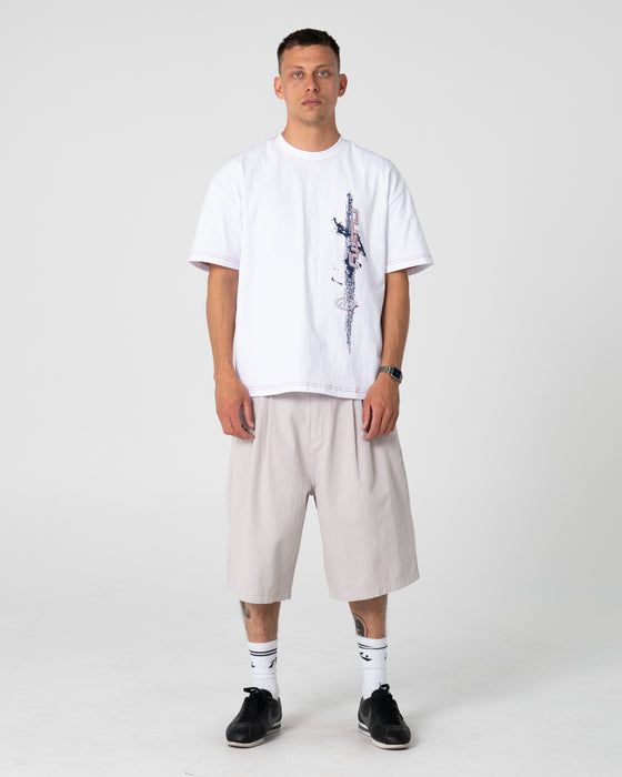 man-wearing-enigma-pleated-short-in-stone