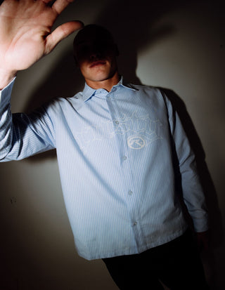 Man wearing Freaker Long Sleeve Shirt in Sky Blue