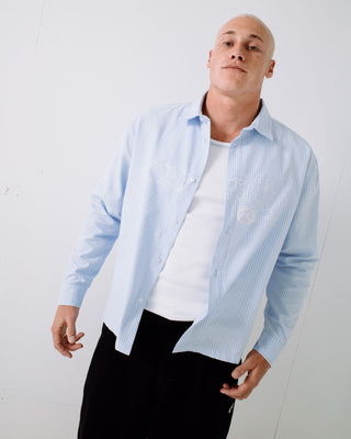 Man wearing Freaker Long Sleeve Shirt in Sky Blue