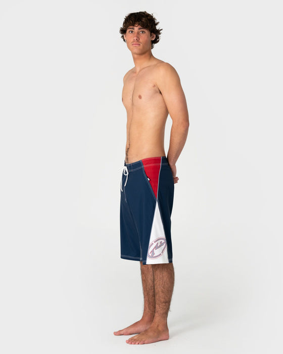 man-wearing-sandglass-fixed-waist-boardshort-in-navy-blue