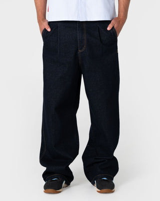 Man wearing Cashflow Pleated Baggy Jean in Raw Dawg Blue