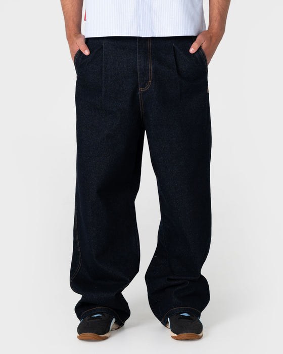 man-wearing-cashflow-pleated-baggy-jean-in-raw-dawg-blue