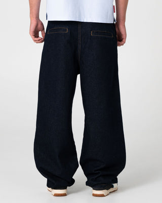 Man wearing Cashflow Pleated Baggy Jean in Raw Dawg Blue