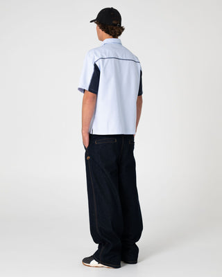 Man wearing Cashflow Pleated Baggy Jean in Raw Dawg Blue