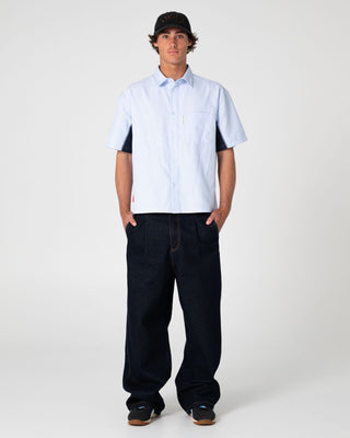 Man wearing Cashflow Pleated Baggy Jean in Raw Dawg Blue