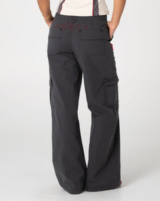 Woman wearing Rusty Cargo Low Rise Wide Pant in Washed Black