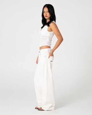 Woman wearing Snowy Lucy Loose Low Rise Jean in Snowy White