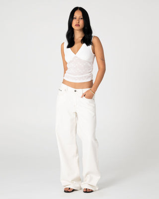 Woman wearing Snowy Lucy Loose Low Rise Jean in Snowy White