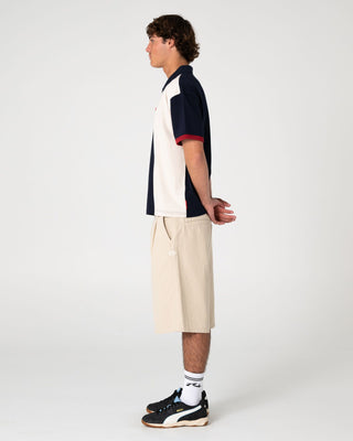 Man wearing Pop Up Short Sleeve Polo in Navy Blue