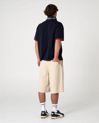 Man wearing Pop Up Short Sleeve Polo in Navy Blue
