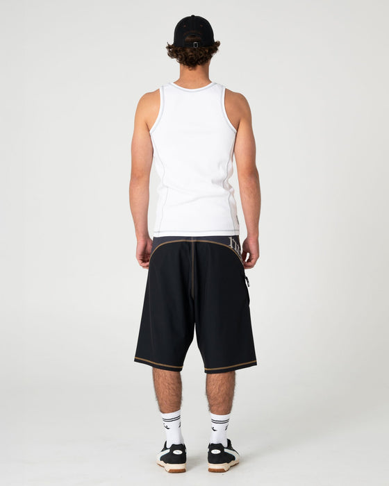 man-wearing-slack-jack-ribbed-heavy-tank-in-white
