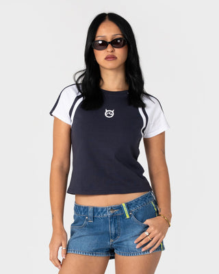 Woman wearing Devil Baby Raglan Cap Sleeve Tee in Navy / White