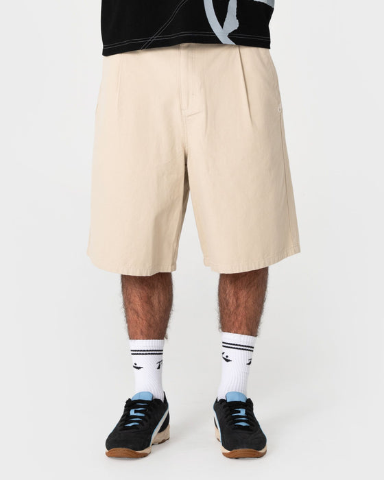 man-wearing-shindawg-pleated-short-in-abbey-stone