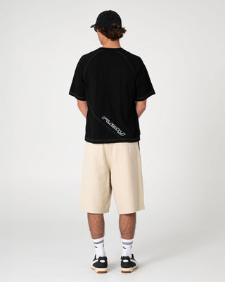 Man wearing Shindawg Pleated Short in Abbey Stone