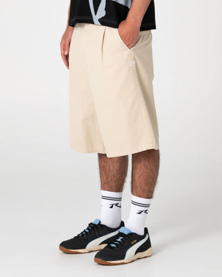 Man wearing Shindawg Pleated Short in Abbey Stone
