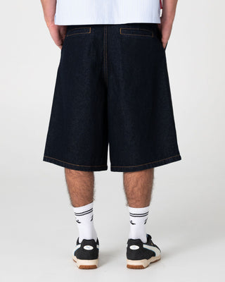 Man wearing Cashflow Pleated Jort in Raw Dawg Blue