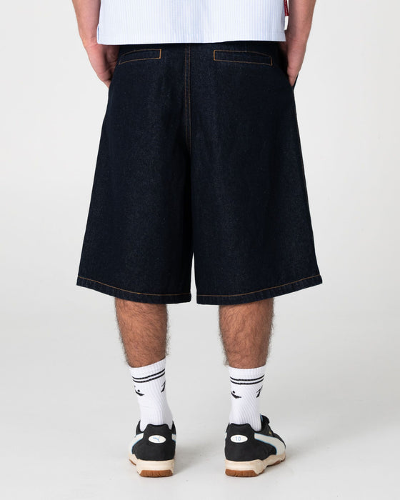 man-wearing-cashflow-pleated-jort-in-raw-dawg-blue