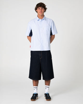Man wearing Cashflow Pleated Jort in Raw Dawg Blue
