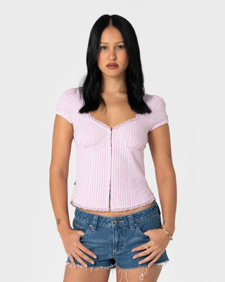 Woman wearing Hook Me Peggy Blouse in Pink Stripe