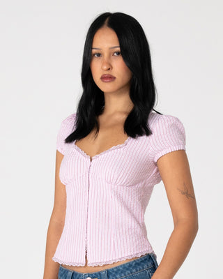 Woman wearing Hook Me Peggy Blouse in Pink Stripe