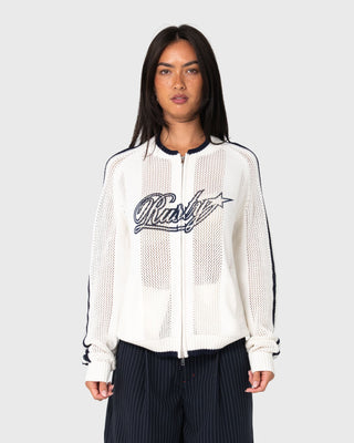 Woman wearing Eugene Zip Through Knit in Egret / Navy Blue