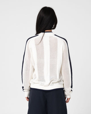 Woman wearing Eugene Zip Through Knit in Egret / Navy Blue