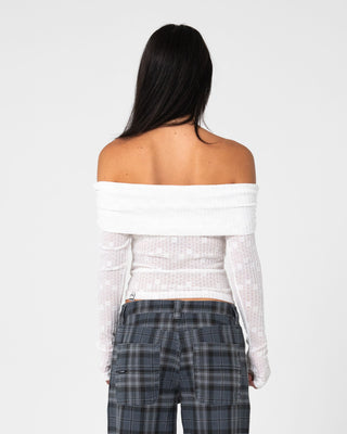 Woman wearing Veera L/S Off Shoulder Top in White