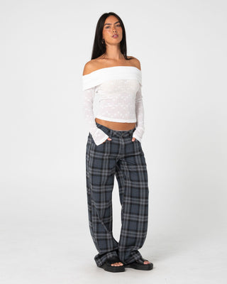 Woman wearing Veera L/S Off Shoulder Top in White