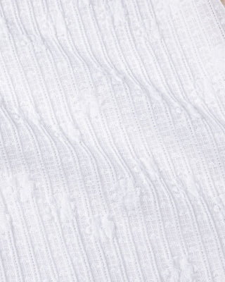 Woman wearing Veera L/S Off Shoulder Top in White