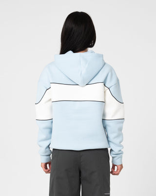 Woman wearing Kinetic Oversized Hooded Fleece in Retro Blue / Egret