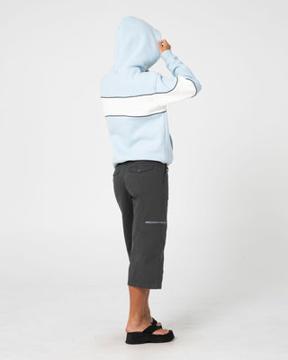 Woman wearing Kinetic Oversized Hooded Fleece in Retro Blue / Egret