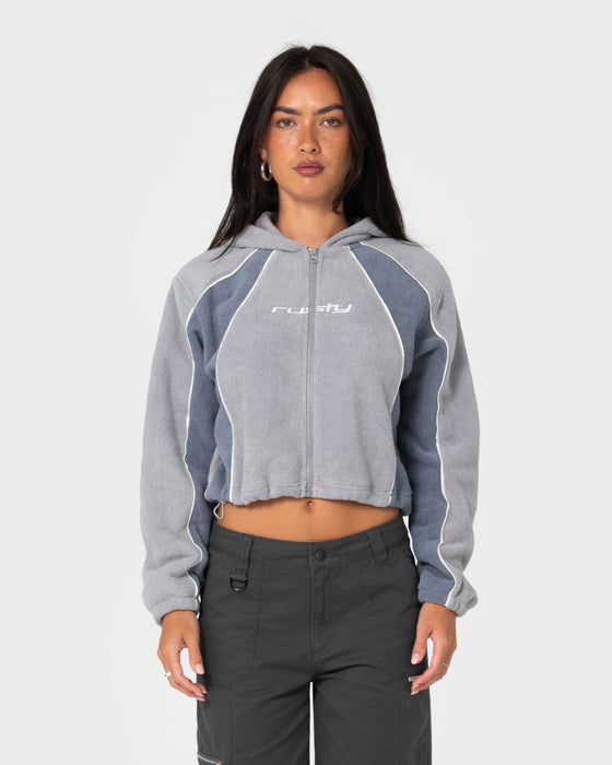 model-wearing-two-tides-cropped-zip-through-polar-fleece-in-grey-atlantic-blue
