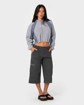 Woman wearing Mini Two Tides Zip Through Polar Fleece in Grey / Atlantic Blue