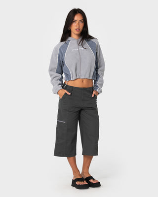 Model wearing Two Tides Cropped Zip Through Polar Fleece in Grey / Atlantic Blue