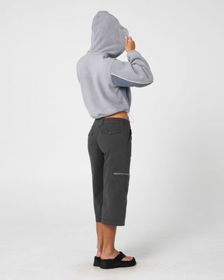 Woman wearing Mini Two Tides Zip Through Polar Fleece in Grey / Atlantic Blue