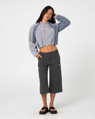 Woman wearing Mini Two Tides Zip Through Polar Fleece in Grey / Atlantic Blue