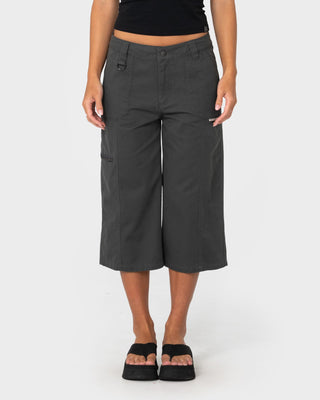 Woman wearing It Gyrl Low Rise Capri Cargo Pant in Carbon