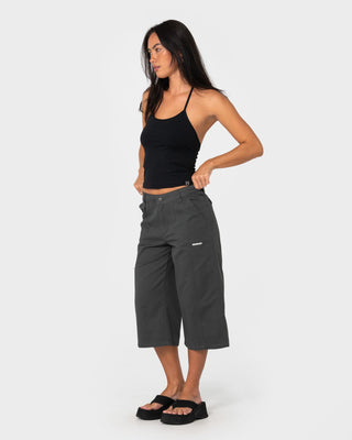 Woman wearing It Gyrl Low Rise Capri Cargo Pant in Carbon