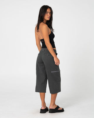 Woman wearing It Gyrl Low Rise Capri Cargo Pant in Carbon