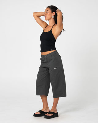 Woman wearing It Gyrl Low Rise Capri Cargo Pant in Carbon