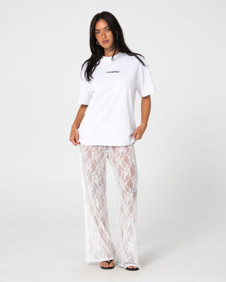 Woman wearing Lorelai Lace Straight Leg Pant in White