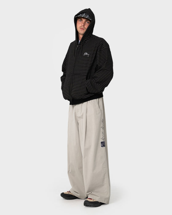 man-wearing-mista-mista-elastic-pant-in-stone