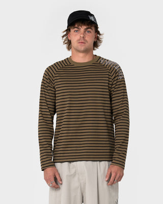 Man wearing Huff N Puff Long Sleeve Tee in Savanna