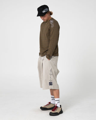 Man wearing Huff N Puff Long Sleeve Tee in Savanna